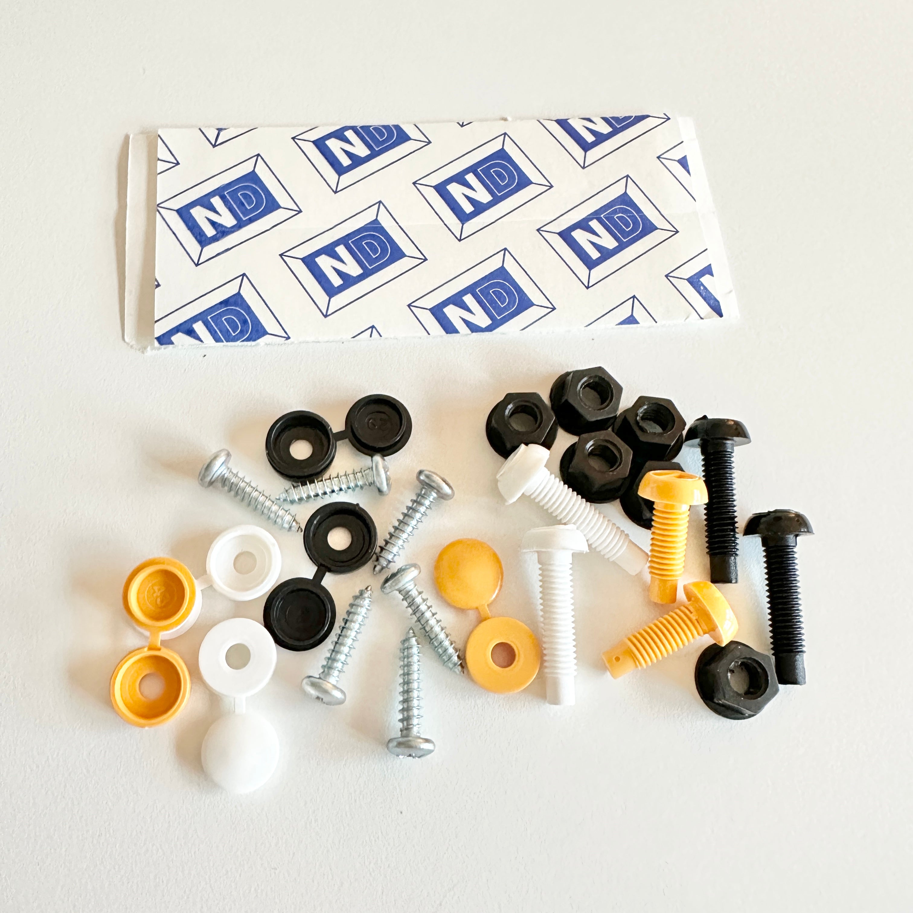 Number Plate Fixing Kit 8 Sticky Pads 2x White, 2x Yellow 2x Black Caps 6 Screws Number Plate Fixing Kit 8 Sticky Pads 2x White, 2x Yellow 2x Black Caps 6 Screws